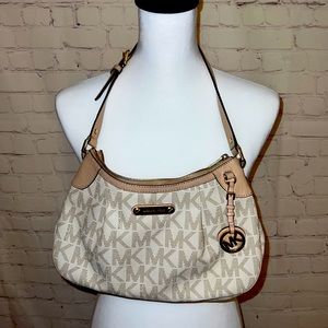 Gently used cream tone with gold accent Michael Kors handbag
